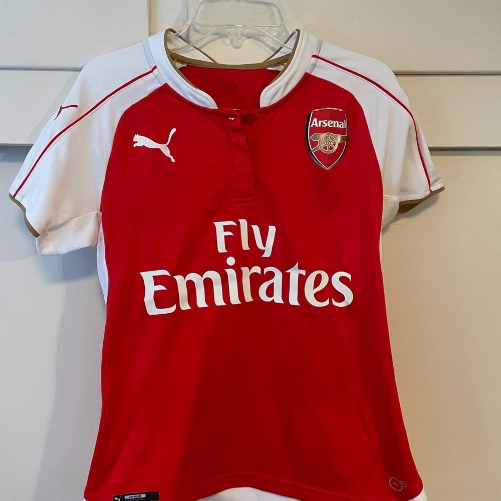 Red and white women’s Arsenal jersey